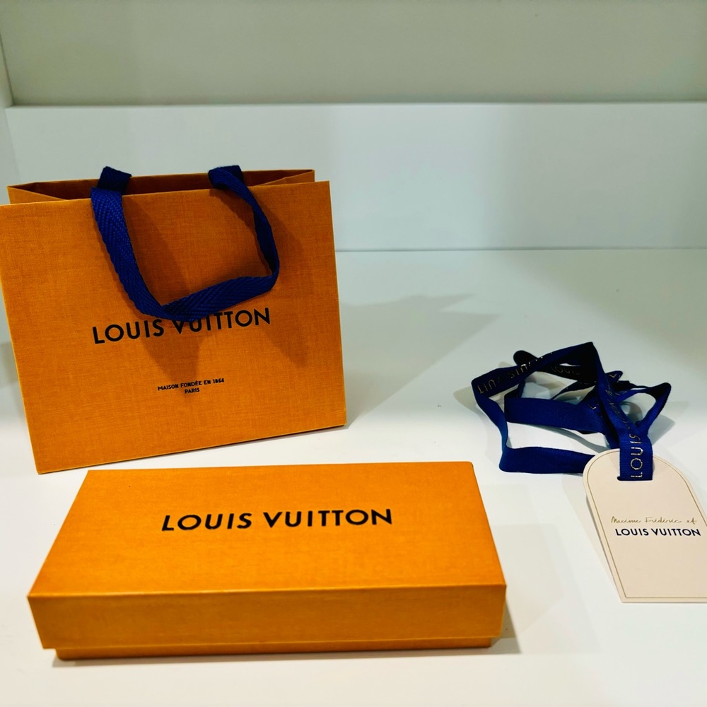 Louis Vuitton Empty gift box and bag with ribbon and tag.